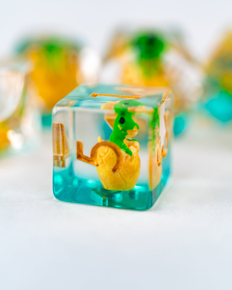 Chomper | Dino Egg | 7 Piece Acrylic Inclusion Dice Set - Emberglow Gaming